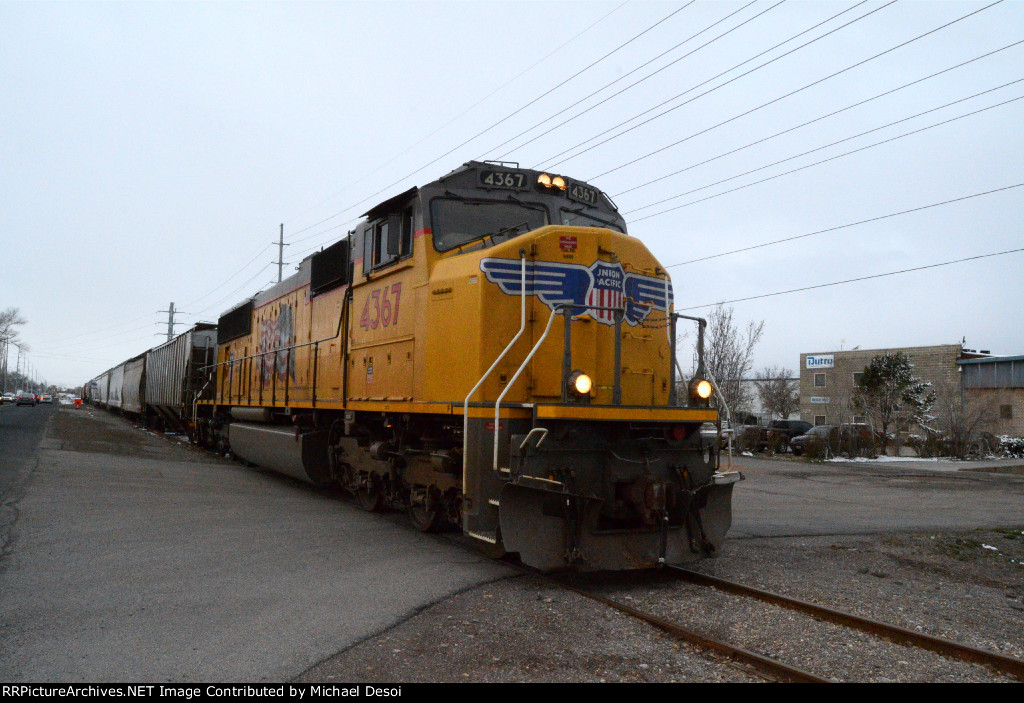 UP SD70M #4367 leads the northbound Cache Valley Local (LCG-41C) just north of 400 N. off of 600 W. in Logan, Utah. April 13, 2022